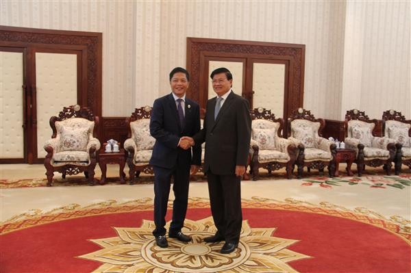 PM Laos merangsang badan usaha Vietnam melakukan investasi di Laos - ảnh 1
