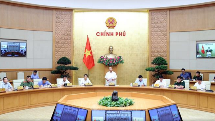 Premierminister Nguyen Xuan Phuc tagt mit dem nationalen Verwaltungsstab für Covid-19-Bekämpfung - ảnh 1
