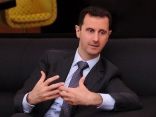 Suriah: Presiden Bashar al-Assad menegaskan kembali akan tidak mengundurkan diri - ảnh 1