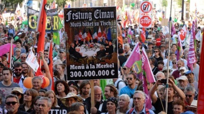 Puluhan ribu orang melakukan pawai untuk memprotes Konferensi G-7 di Federasi Jerman - ảnh 1
