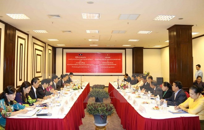 Vietnam dan Laos memperkuat kerjasama di bidang pekerjaan etnis - ảnh 1