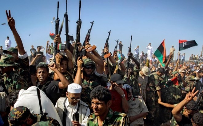 Negara-negara tetangga mengusahakan jalan ke luar untuk krisis Libia - ảnh 1