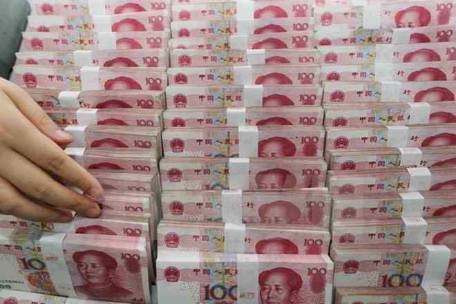 IMF resmi memasukkan mata uang Yuan ke dalam keranjang mata uang internasional - ảnh 1