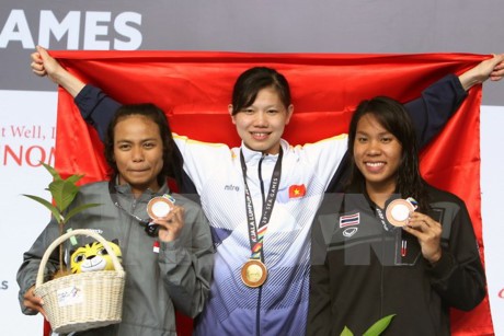 SEA GAME 29: Menggondol lagi 4 medali emas, kontingen olahraga Vietnam menduduki posisi ketiga - ảnh 1