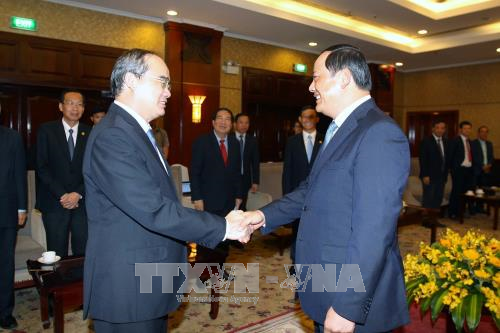 Sekretaris Komite Partai Komunis Kota Ho Chi Minh, Nguyen Thien Nhan menerima Deputi PM Laos, Sonesay Siphandone - ảnh 1
