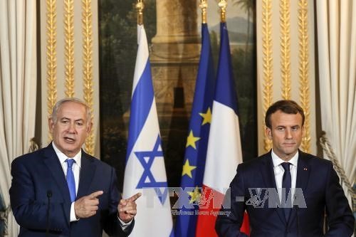  Pemimpin Perancis dan Israel melakukan pembicaraan untuk mengusahakan jalan ke luar bagi proses perdamaian Timur Tengah - ảnh 1