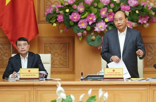 PM Nguyen Xuan Phuc memimpin pertemuan Dewan Konsultasi Kebijakan Keuangan dan Moneter Nasional - ảnh 1