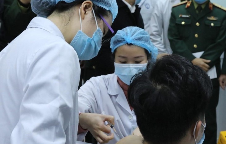 Vietnam Salah Satu Negara dengan Persentase Penerimaan Vaksin Covid-19 Tertinggi - ảnh 1