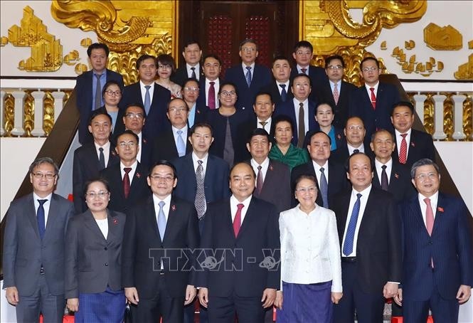За дальнейшее укрепление отношений сотрудничества между партиями, правительствами и парламентами Вьетнама и Лаоса - ảnh 1