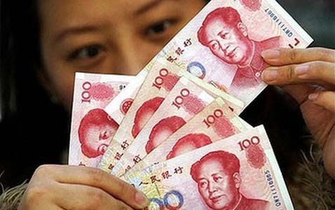 Tiongkok terus mendevaluasikan mata uang Yuan   - ảnh 1