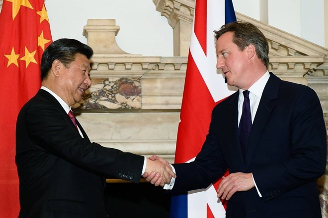 Presiden Tiongkok melakukan pembicaraan dengan PM Inggris - ảnh 1