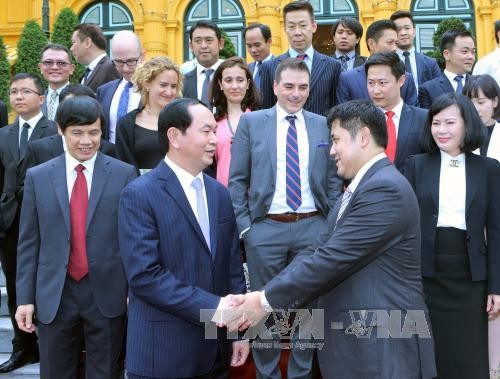 Presiden Tran Dai Quang menerima delegasi badan usaha asing - ảnh 1