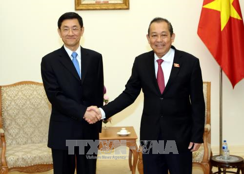 Deputi PM Truong Hoa Binh menerima Deputi Menteri Keamanan Nasional Tiongkok, Tang Chao - ảnh 1