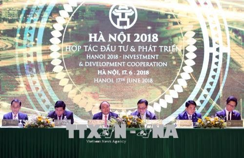 PM Nguyen Xuan Phuc menghadiri Konferensi “Hanoi 2018- Kerjasama Investasi dan Perkembangan” - ảnh 1