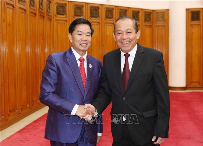 Deputi Harian PM Truong Hoa Binh menerima Sekretaris, Gubernur Ibukota Vientiane, Laos - ảnh 1
