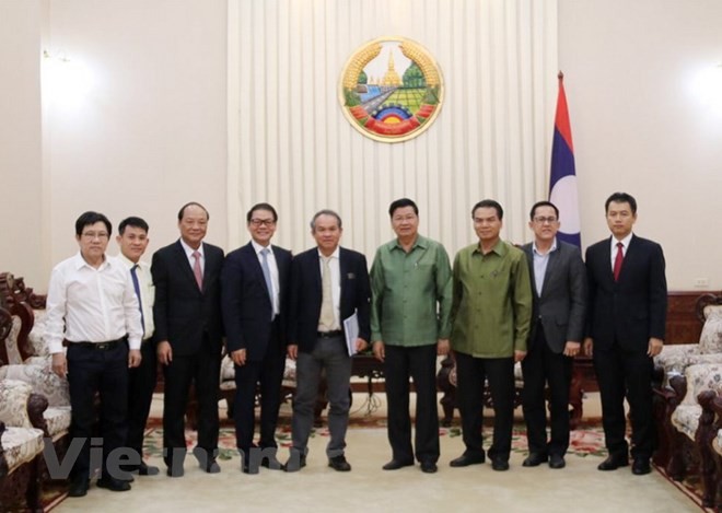 Laos berkomitmen menciptakan syarat bagi badan-badan usaha Vietnam untuk mengembangkan pertanian secara berkesinambungan  - ảnh 1