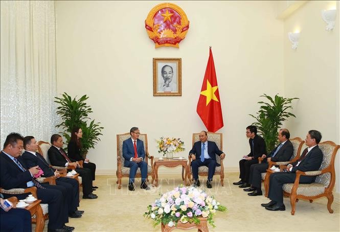 Prime Minister receives outgoing Lao Ambassador - ảnh 1