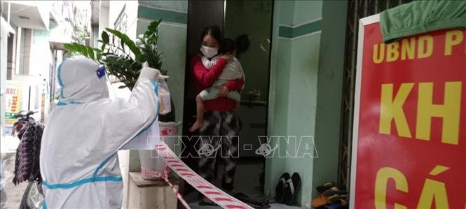 Vietnam records 14,819 new COVID-19 cases on Friday  - ảnh 1