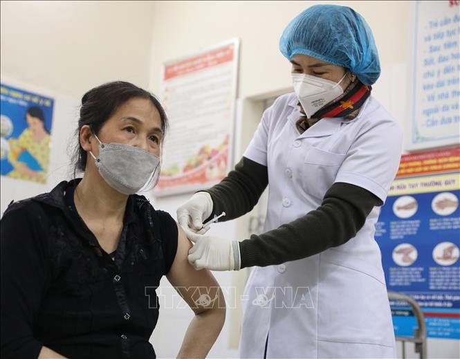 Vietnam records 26,500 new cases of COVID-19 on Friday  - ảnh 1