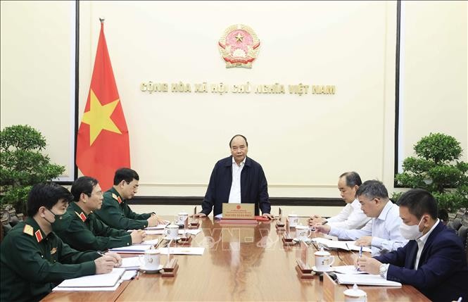 President reviews 10-year implementation of national defense strategy resolution  - ảnh 1