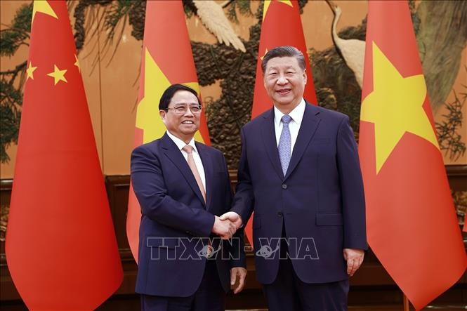 PM meets with Party General Secretary and President of China Xi Jinping - ảnh 1