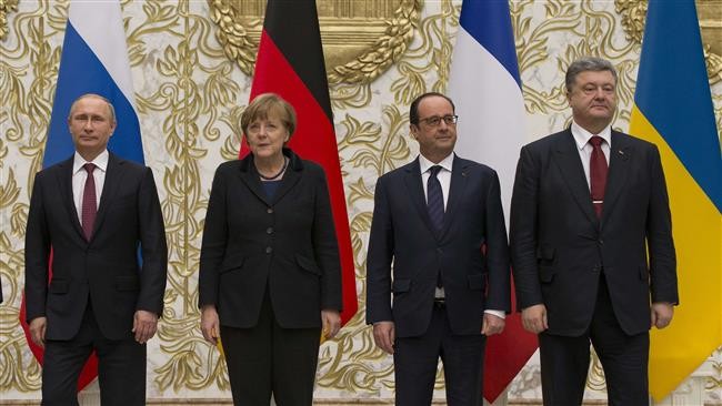 ผู้นำรัสเซีย เยอรมนี และฝรั่งเศส แสวงหามาตรการทางการเมืองให้แก่วิกฤติยูเครน - ảnh 1