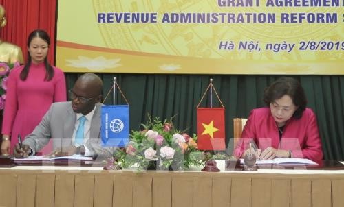 Подписано соглашение о предоставлении безвозмездной финансовой помощи для проведения налоговой реформы во Вьетнаме - ảnh 1