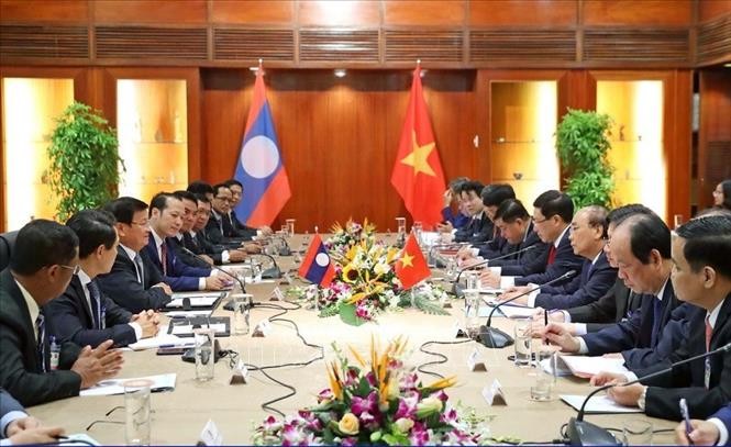 Визит президента Нгуен Суан Фука в Лаос поспособствует углублению отношений между двумя странами - ảnh 1