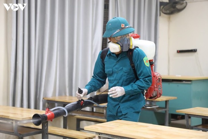 Hanoi disinfects exam sites to mitigate COVID-19 risk - ảnh 4