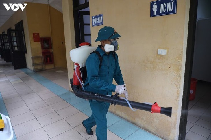 Hanoi disinfects exam sites to mitigate COVID-19 risk - ảnh 9