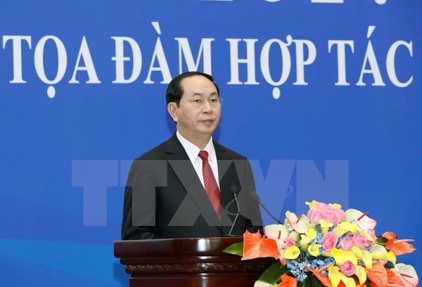 President attends Vietnam-China economic, trade cooperation seminar - ảnh 1