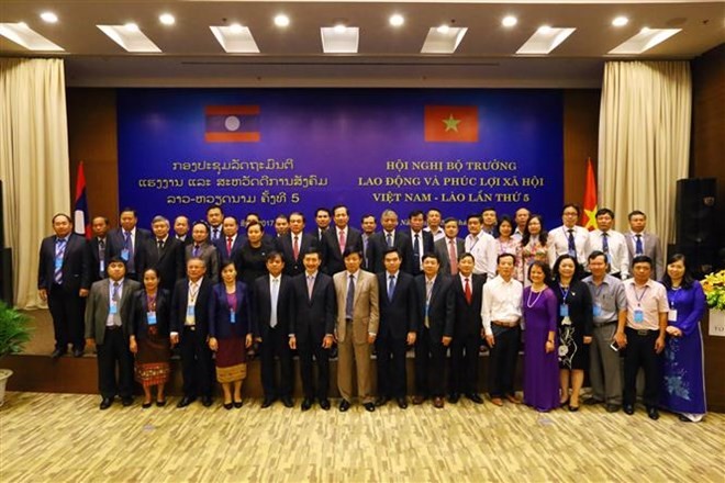 Vietnam, Laos boosts cooperation in labor, social affairs  - ảnh 1
