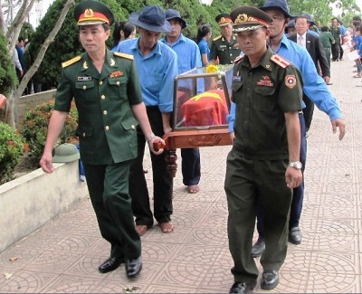 Truy điệu và an táng hài cốt liệt sĩ quân tình nguyện và chuyên gia Việt Nam hy sinh tại Lào  - ảnh 1