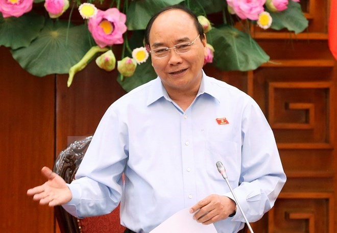 Premier de Vietnam viaja a Camboya para Cumbre de Triángulo de Desarrollo CLV - ảnh 1