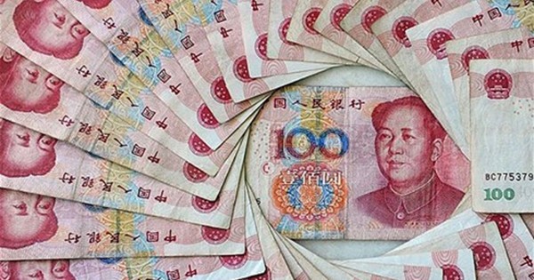 จีนกำหนดอัตราแลกเปลี่ยนเงินหยวนในระดับต่ำที่สุดในรอบ 5 ปี - ảnh 1
