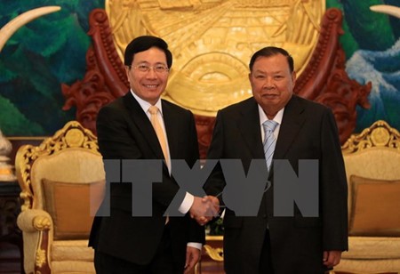 รองนายกรัฐมนตรีเวียดนามฝามบิ่งมิงห์เยือนประเทศลาวอย่างเป็นทางการ - ảnh 1