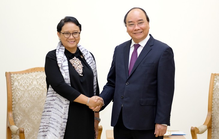 นายกรัฐมนตรีเวียดนามให้การต้อนรับรัฐมนตรีต่างประเทศอินโดนีเซีย - ảnh 1
