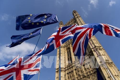 UK, EU reach draft Brexit agreement - ảnh 1