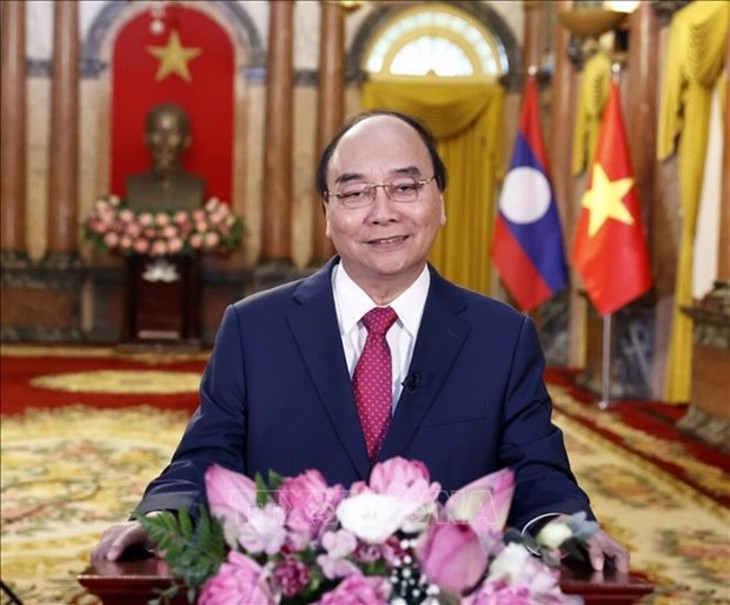 Presidents of Vietnam and Laos praise bilateral friendship  - ảnh 1