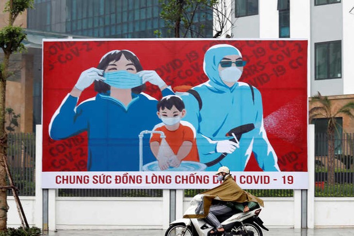 Американское СМИ отмечает успех Вьетнама в сдерживании пандемии COVID-19 - ảnh 1