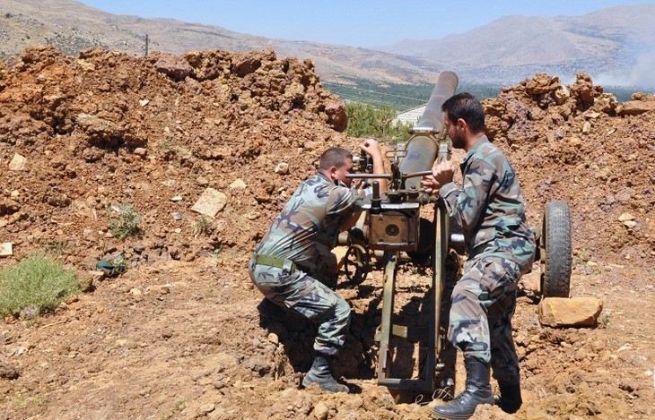 Сирийская армия ведет бои с боевиками ИГ на окраине Пальмиры - ảnh 1