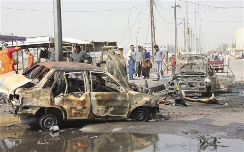 Более 100 человек погибли в Ираке при теракте на рынке  - ảnh 1