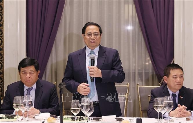 Премьер-министр Фам Минь Тинь принял участие в семинаре по сотрудничеству во имя устойчивого развития  - ảnh 1