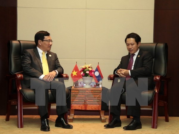 Hoạt động của Phó Thủ tướng, Bộ trưởng Ngoại giao Phạm Bình Minh tại Lào - ảnh 1