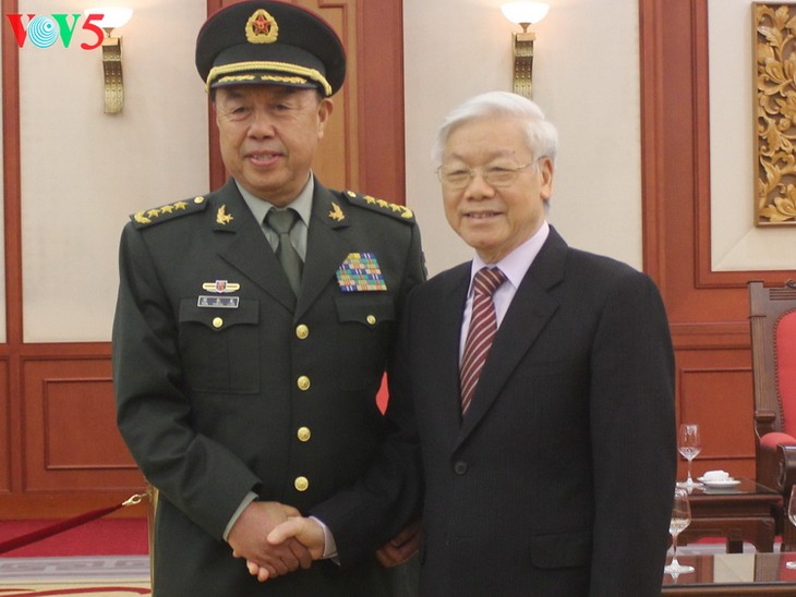 ผู้นำพรรคและรัฐเวียดนามให้การต้อนรับรองหัวหน้าคณะกรรมาธิการการทหารส่วนกลางจีน - ảnh 1