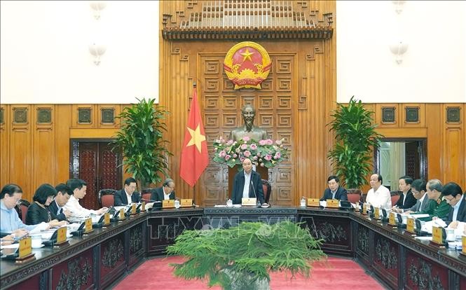 นายกรัฐมนตรีเวียดนามเป็นประธานในการประชุมระหว่างรัฐบาลกับกระทรวงและหน่วยงานต่างๆเกี่ยวกับร่างมติ 01 - ảnh 1