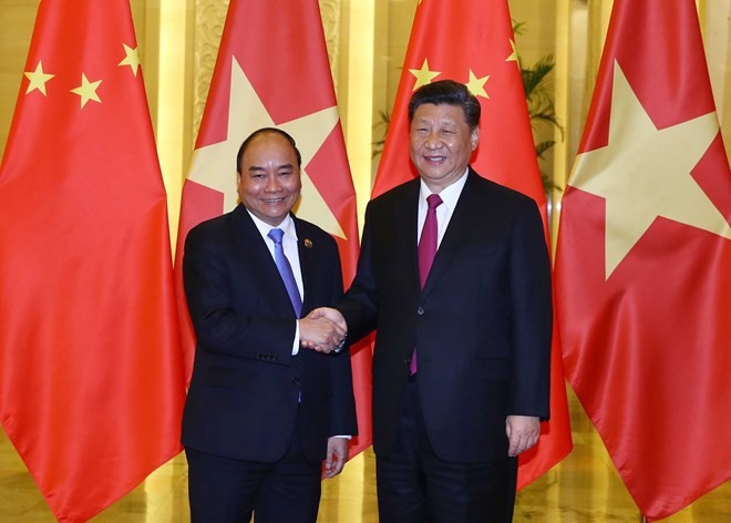 PM Phuc meets Chinese Party chief and President Xi Jinping in Beijing - ảnh 1