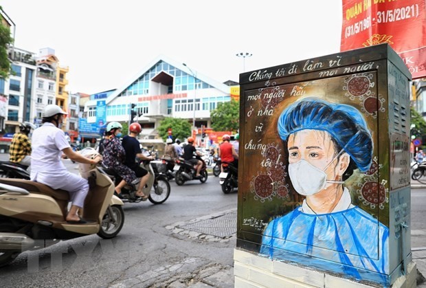 Lao PM extends sympathy to Vietnam over COVID-19 outbreak - ảnh 1