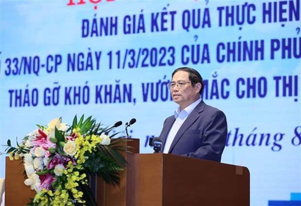 PM calls for joint efforts to remove roadblocks to real estate market - ảnh 1