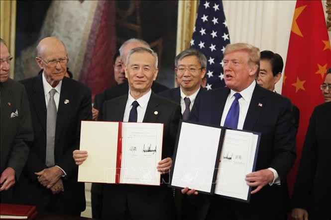 Acuerdo comercial de primera fase entre Estados Unidos y China frena su guerra comercial - ảnh 1